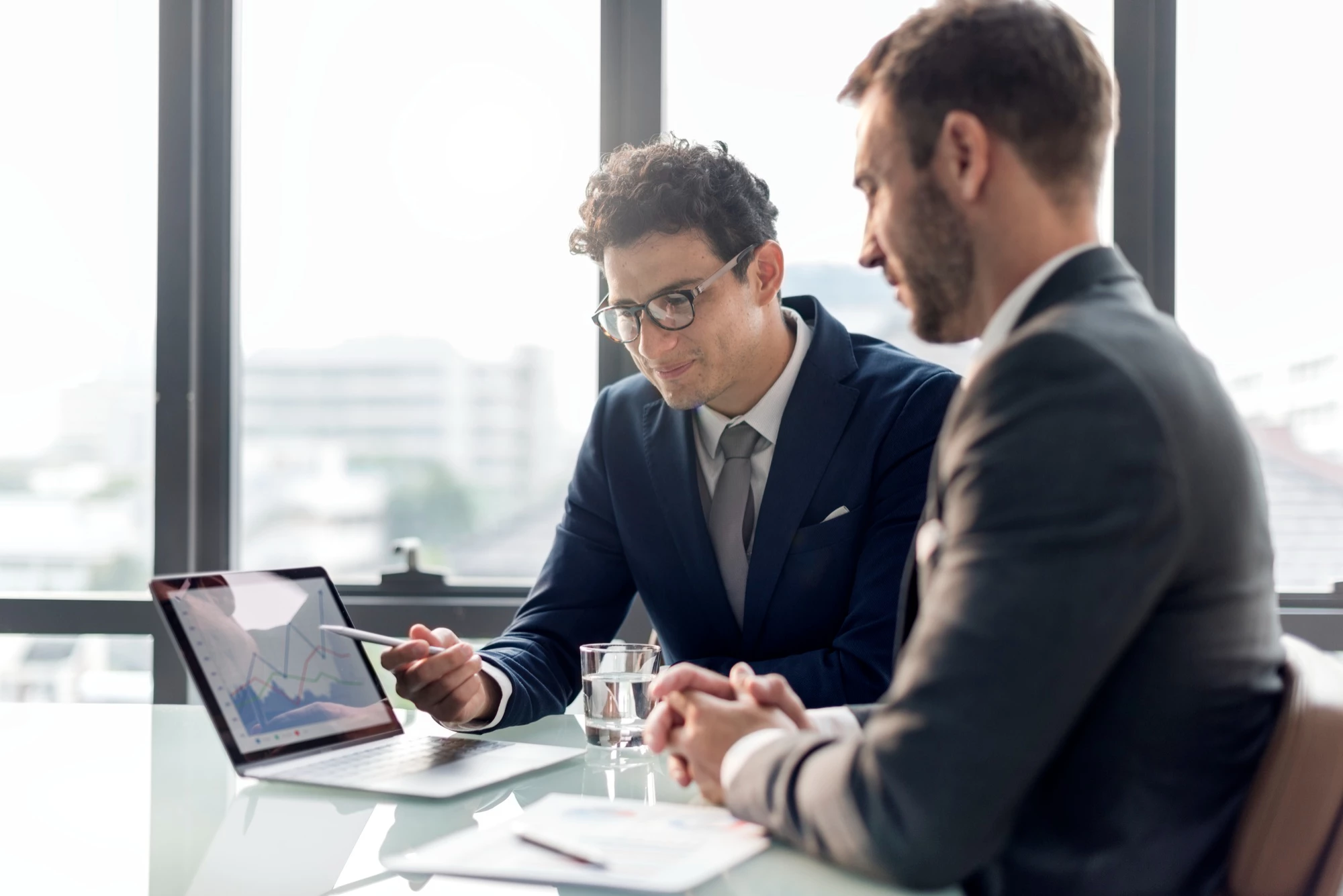 business meeting discussing who is offering best landing page builder