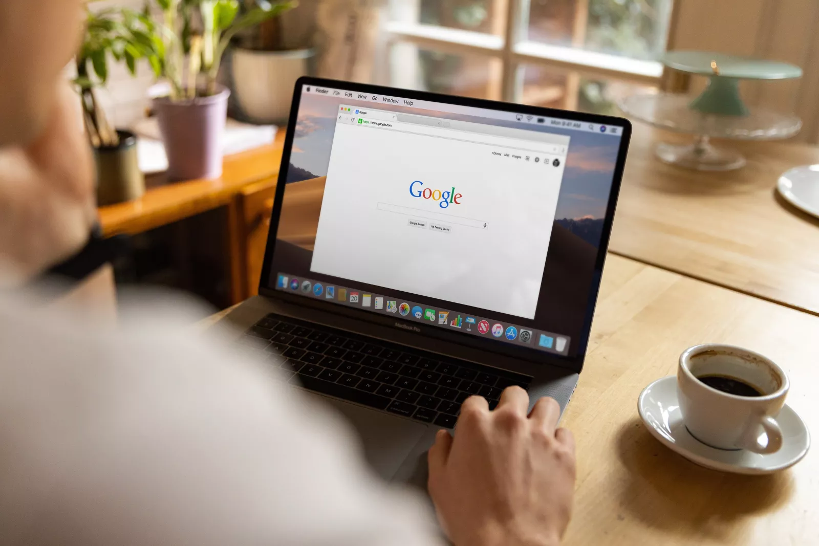 person with an internet browser open with google search engine