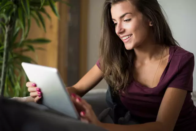 woman browsing the internet on her IPad